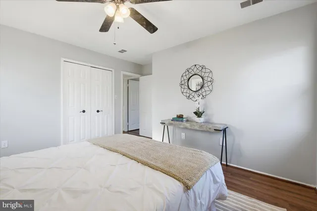 a bedroom with bed and a window