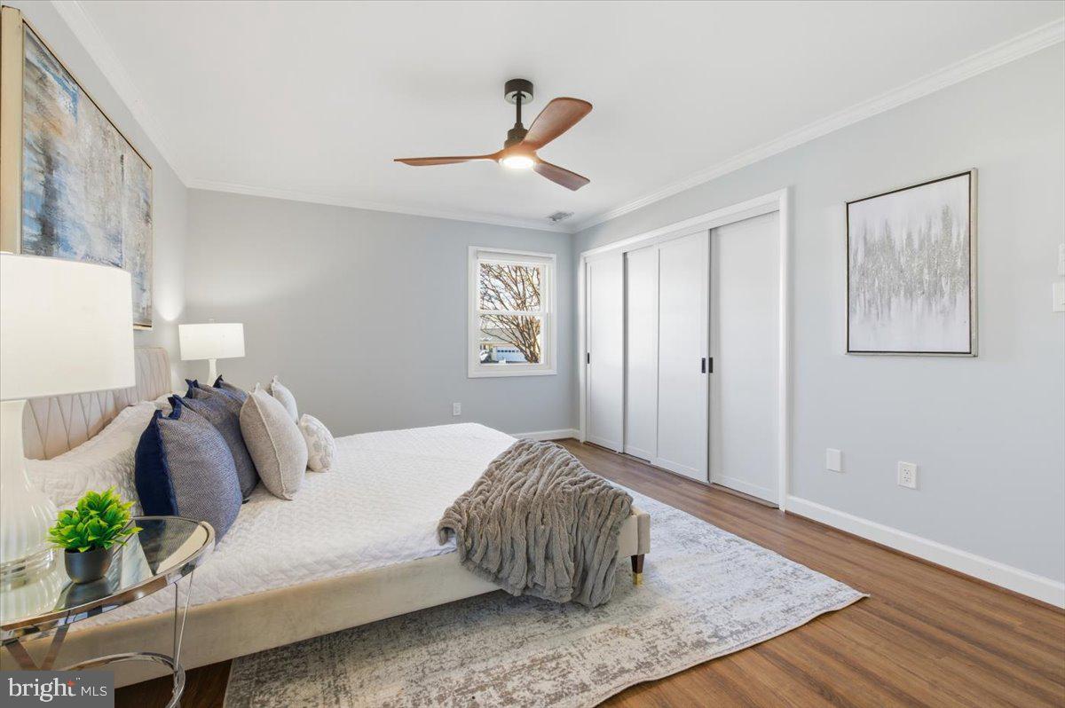 6906 Sprouse Court Springfield, VA 22153 - Photo 22 of 37 a bedroom with a bed and wooden floor