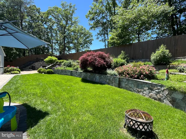 a view of a table and chairs under an umbrella