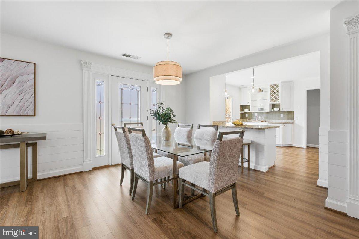 6906 Sprouse Court Springfield, VA 22153 - Photo 6 of 37 a view of a dining room with furniture window and wooden floor