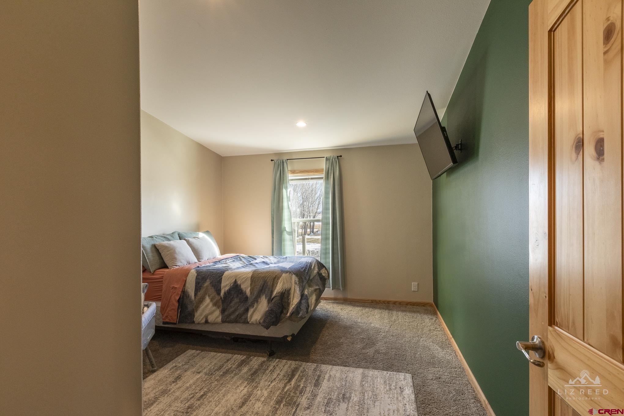 55339 Begonia Road Delta, CO 81416 - Photo 12 of 34 a bedroom with bed and a window