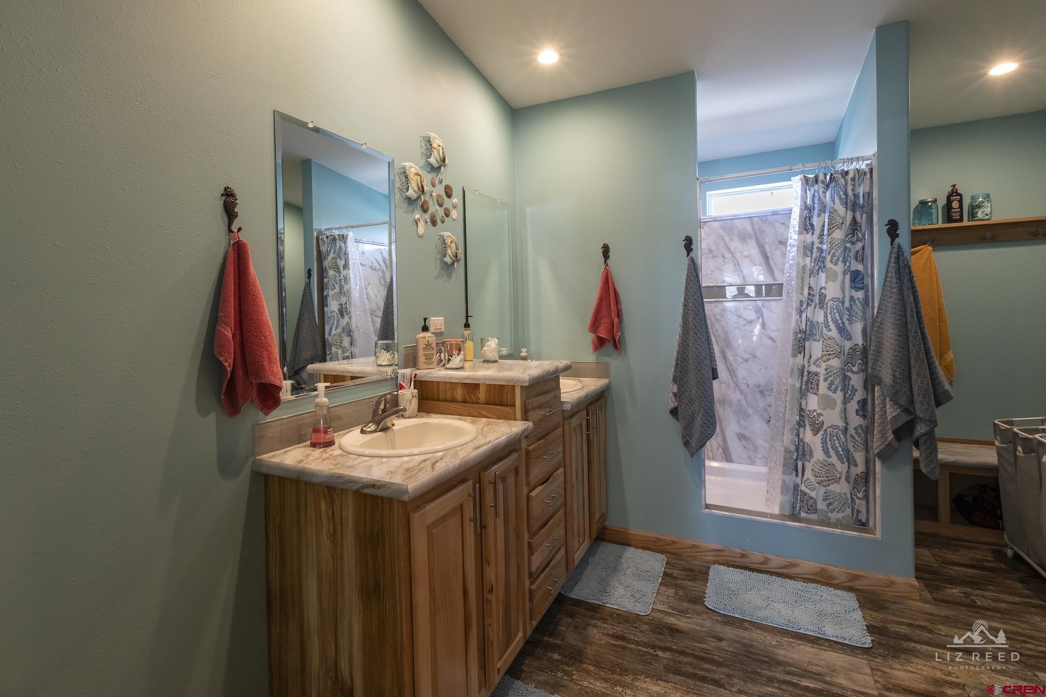 55339 Begonia Road Delta, CO 81416 - Photo 13 of 34 a bathroom with double vanity and a mirror