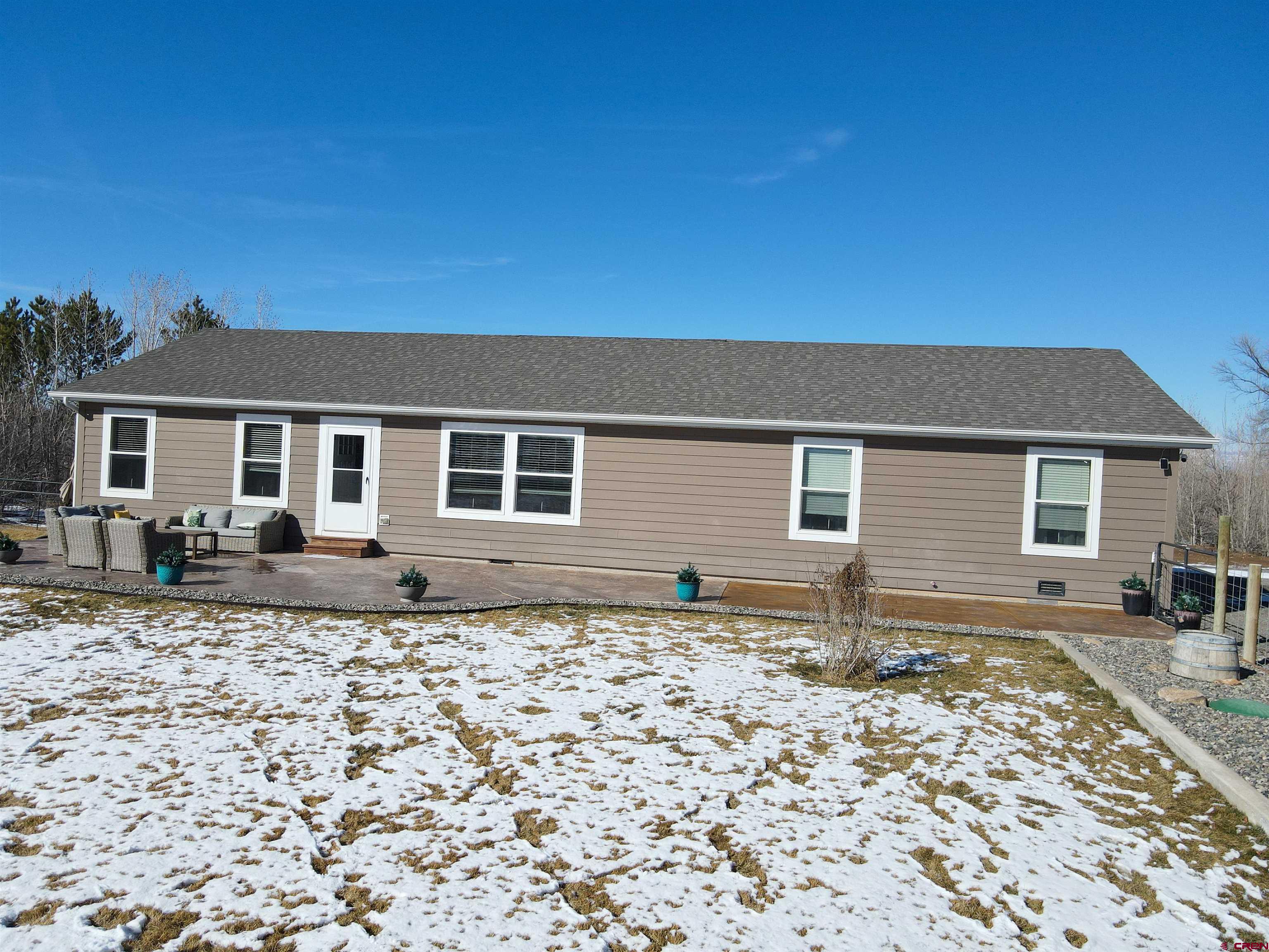 55339 Begonia Road Delta, CO 81416 - Photo 14 of 34 front view of a house with a yard