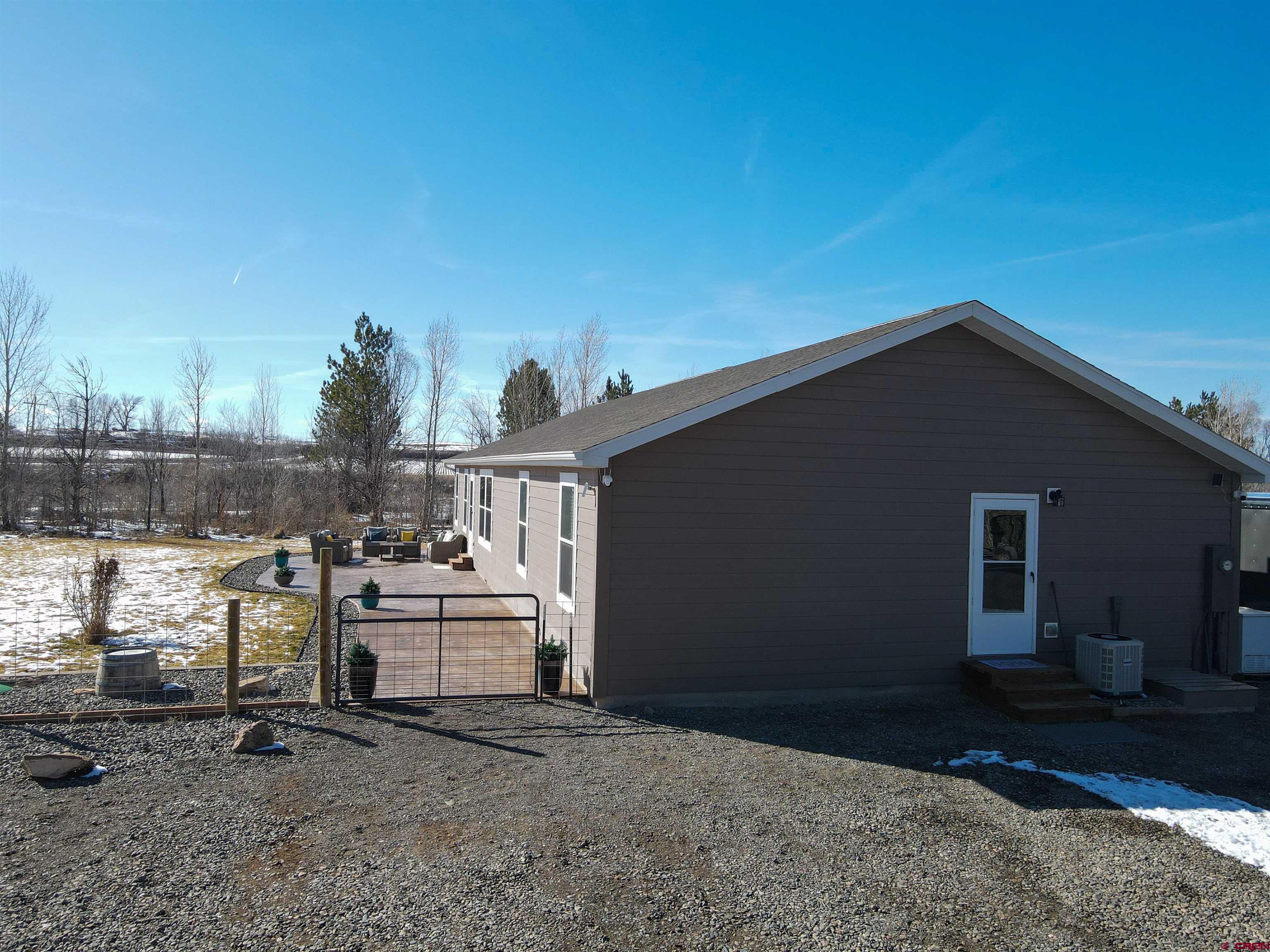 55339 Begonia Road Delta, CO 81416 - Photo 20 of 34 a view of a house with backyard
