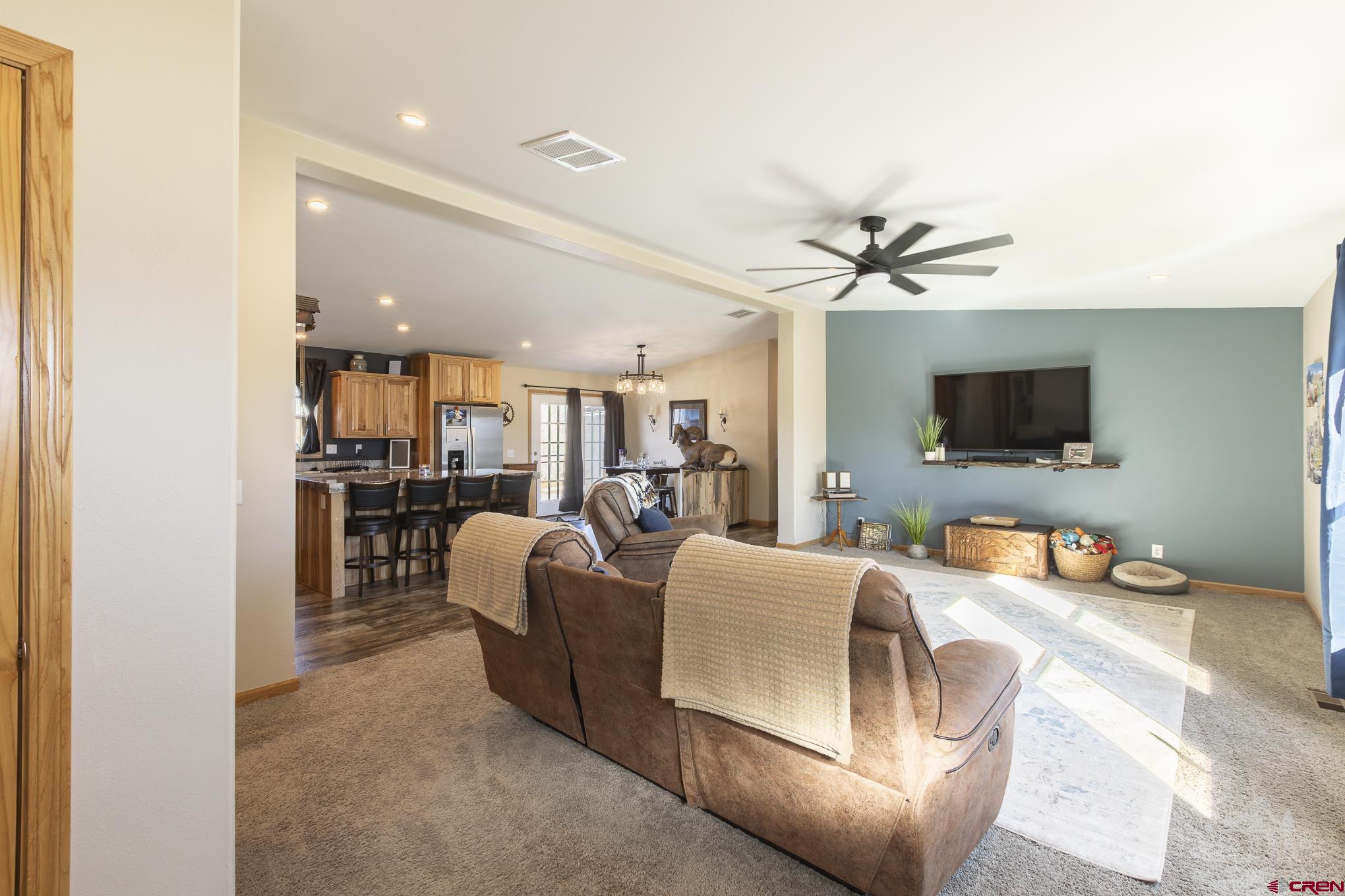 55339 Begonia Road Delta, CO 81416 - Photo 31 of 34 a living room with furniture and a flat screen tv