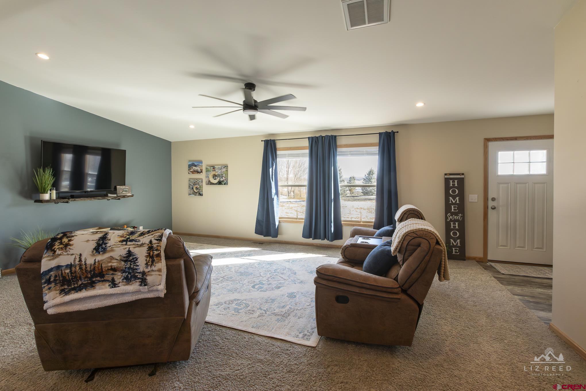 55339 Begonia Road Delta, CO 81416 - Photo 6 of 34 a living room with furniture and a large window