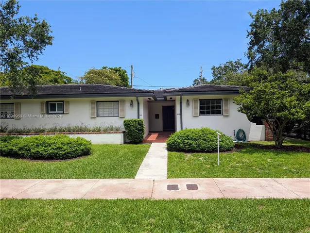 a view of backyard with a garden and entertaining space