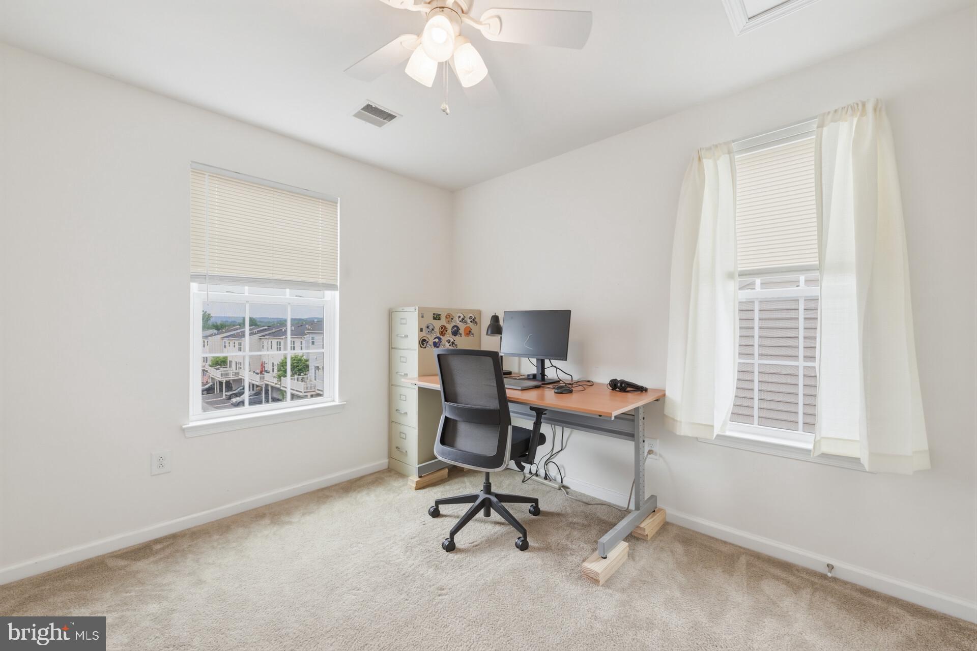 325 Schmidt Road Phoenixville, PA 19460 - Photo 19 of 27 a view of a workspace with furniture and a window