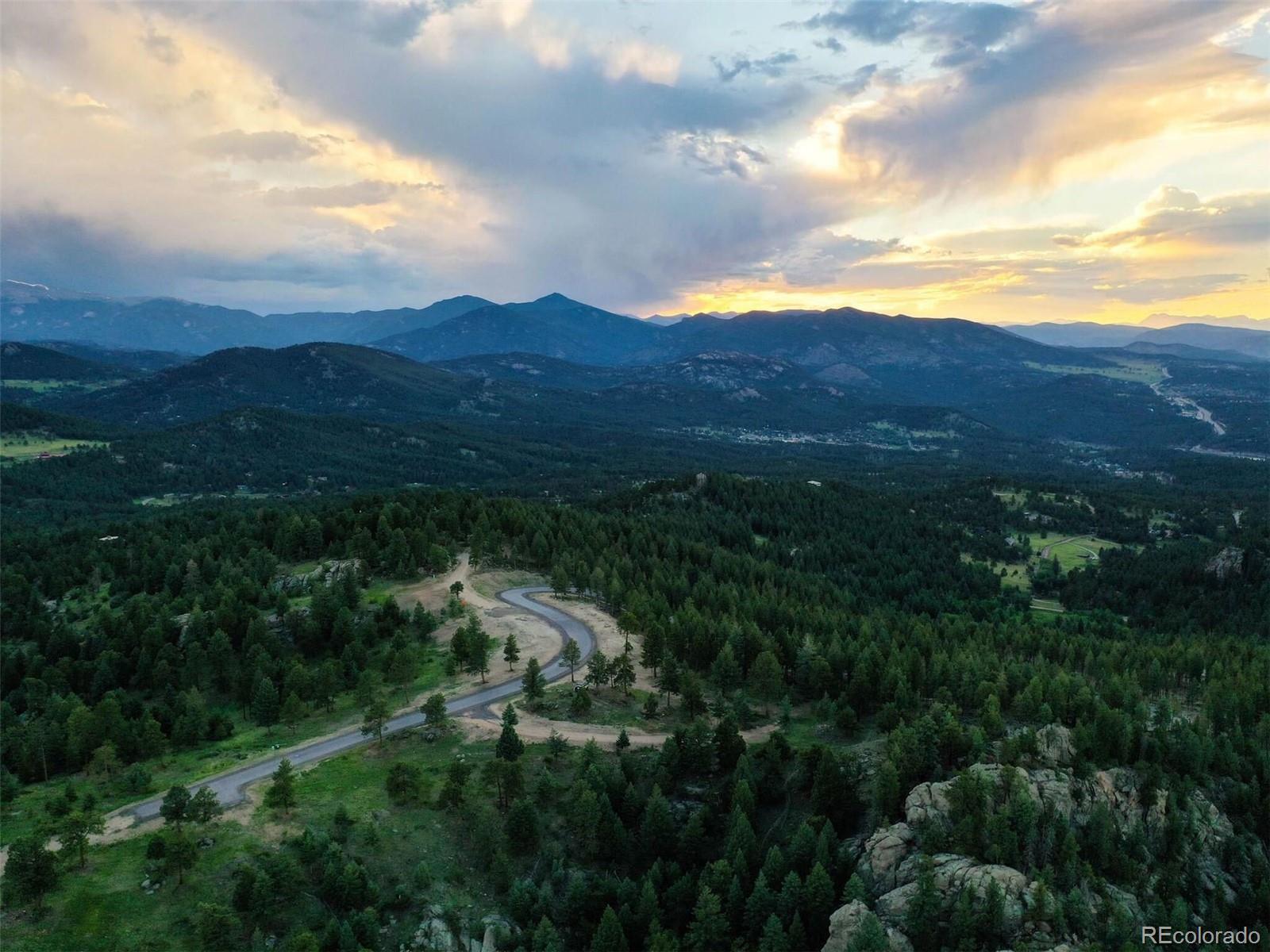 6371 Canyon Creek Road Evergreen, CO 80439 - Photo 34 of 50 a view of a city with lush green forest