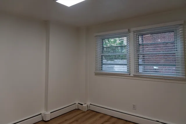 a view of a hallway with a wooden door