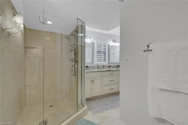 a bathroom with a shower and a sink