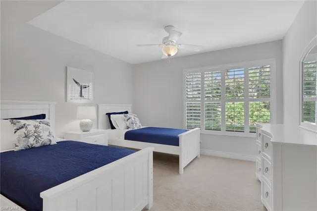 a bedroom with furniture and a window