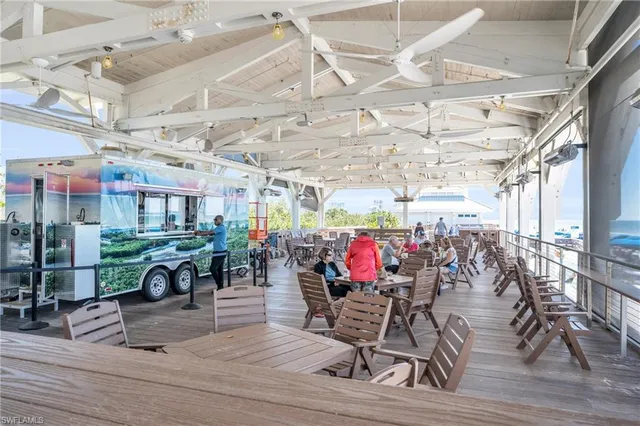a view of a room with lots of wooden furniture