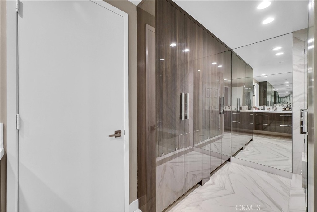 850 East Ocean Boulevard, Unit 1506 Long Beach, CA 90802 - Photo 18 of 58 a bathroom with a glass shower door and sink