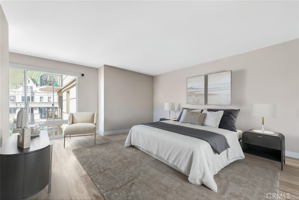 850 East Ocean Boulevard, Unit 1506 Long Beach, CA 90802 - Photo 20 of 58 a bedroom with a bed and a couch