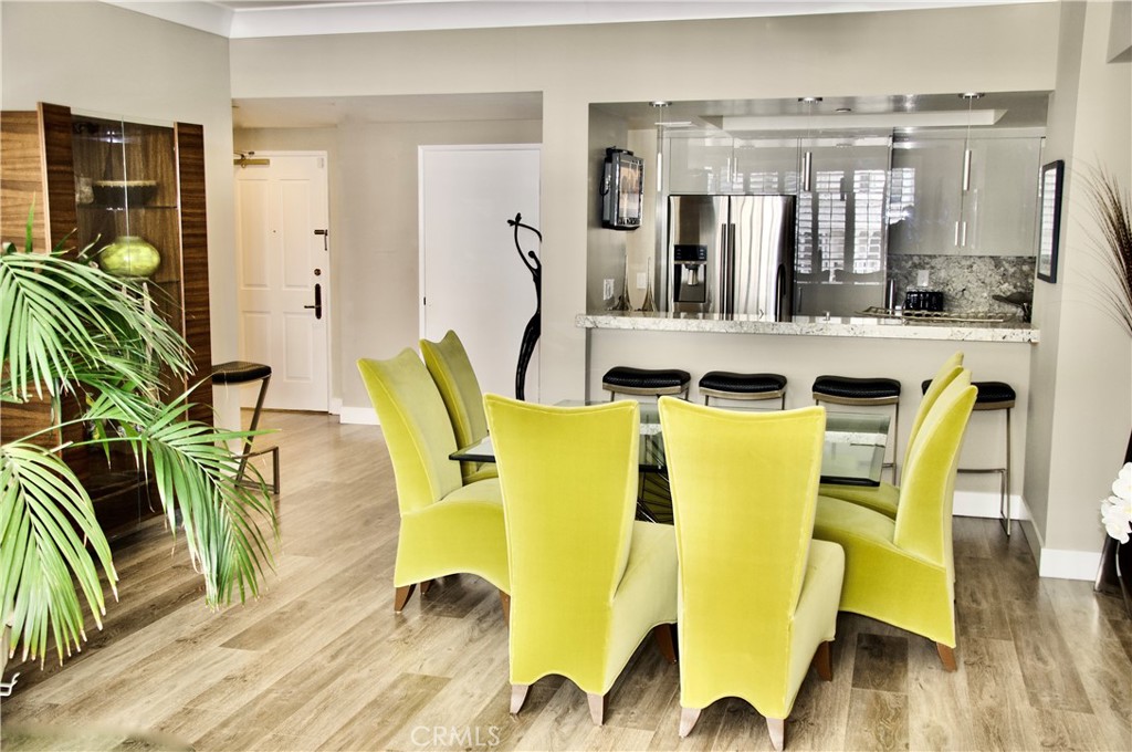 850 East Ocean Boulevard, Unit 1506 Long Beach, CA 90802 - Photo 56 of 58 a view of a dining room with furniture and wooden floor