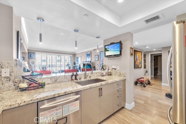 850 East Ocean Boulevard, Unit 1506 Long Beach, CA 90802 - Photo 8 of 58 a kitchen with sink and mirror