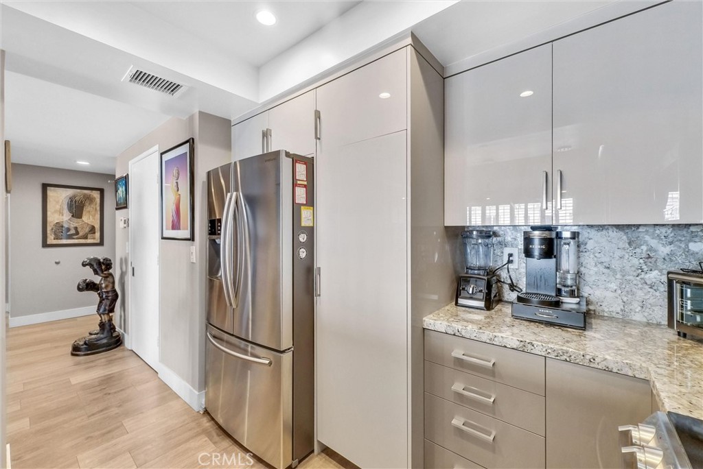 850 East Ocean Boulevard, Unit 1506 Long Beach, CA 90802 - Photo 10 of 58 a kitchen with a refrigerator and a sink