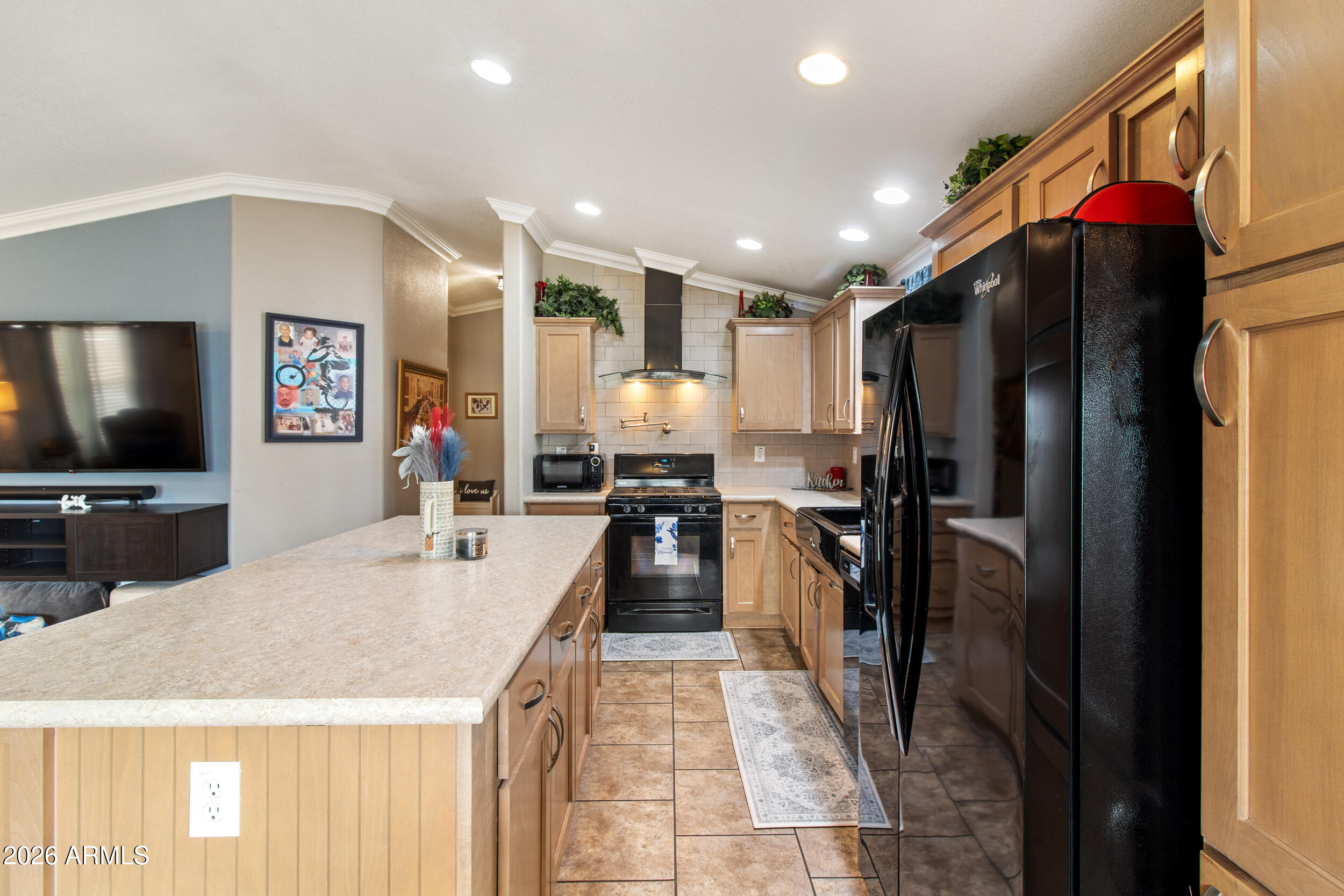 400 West Baseline Road, Unit 220 Tempe, AZ 85283 - Photo 12 of 52 a kitchen with stainless steel appliances kitchen island granite countertop a refrigerator and a stove top oven