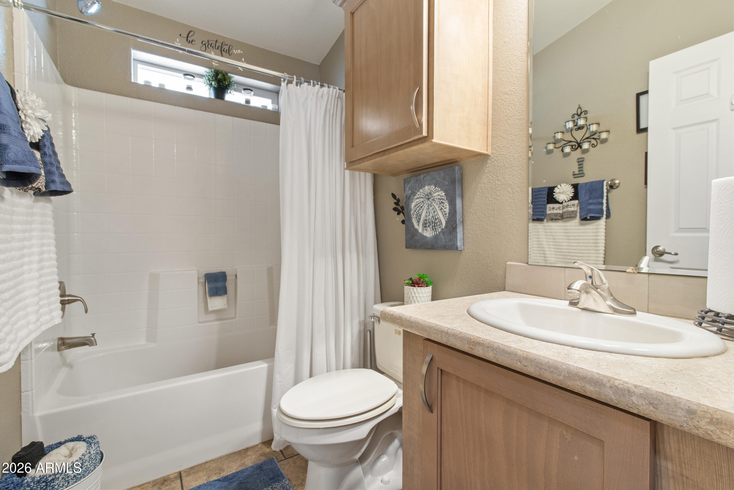 400 West Baseline Road, Unit 220 Tempe, AZ 85283 - Photo 14 of 52 a bathroom with a sink toilet and shower