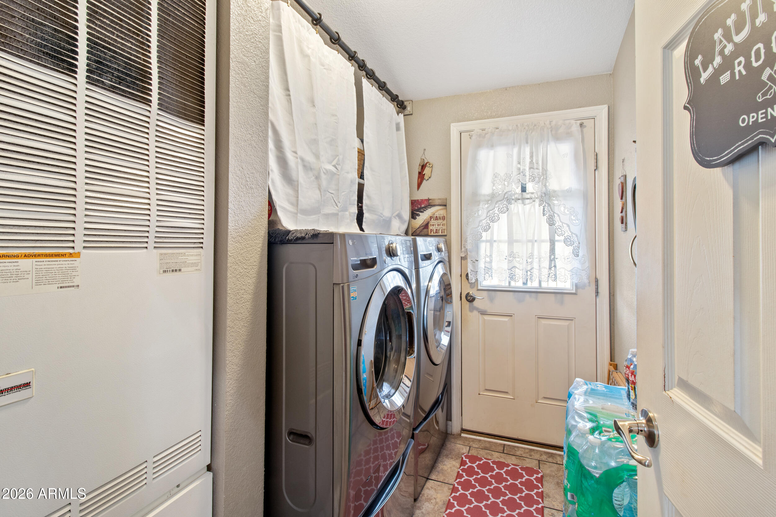 400 West Baseline Road, Unit 220 Tempe, AZ 85283 - Photo 16 of 52 a view of storage and utility room with washer and dryer