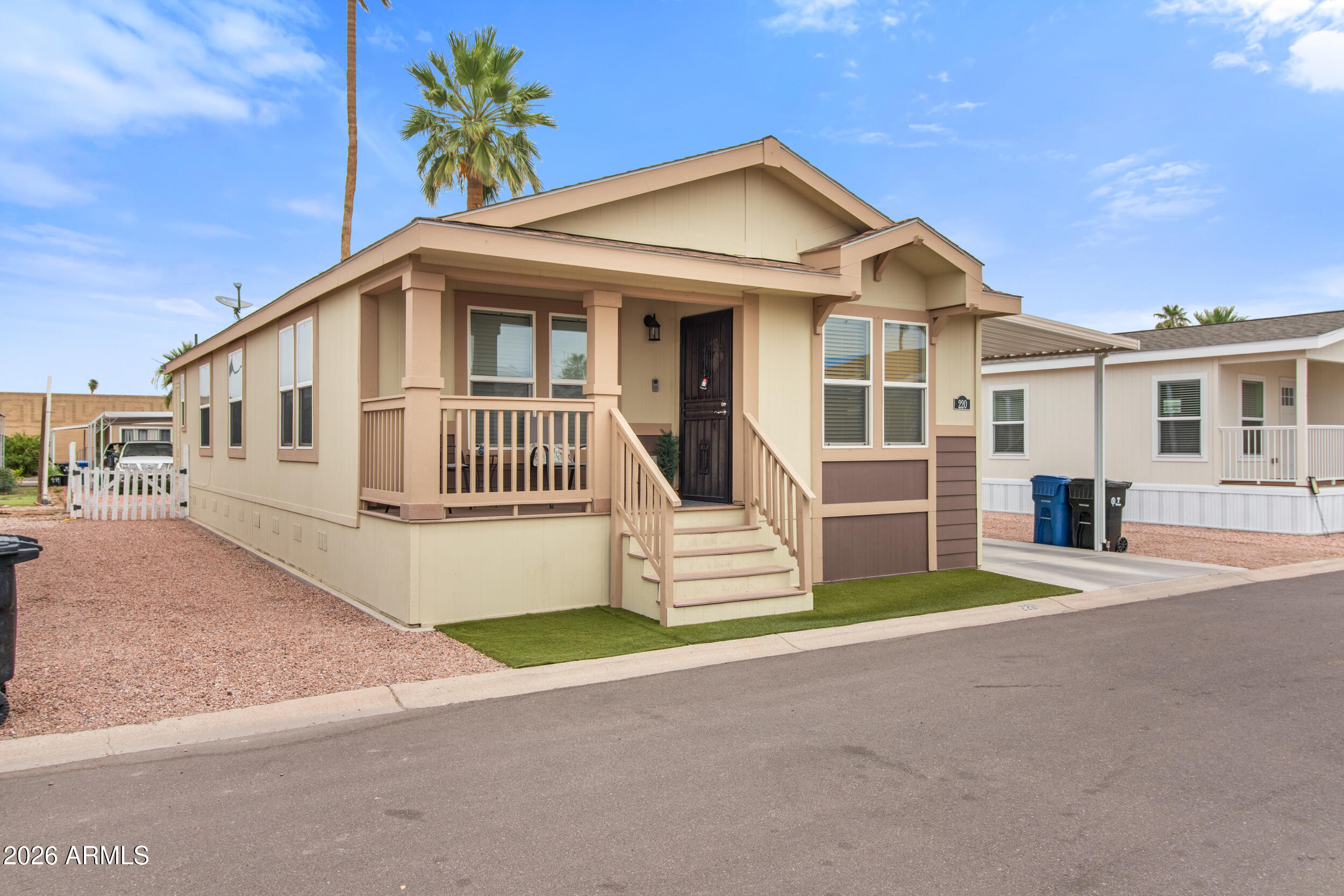 400 West Baseline Road, Unit 220 Tempe, AZ 85283 - Photo 2 of 52 a front view of a house with a garden