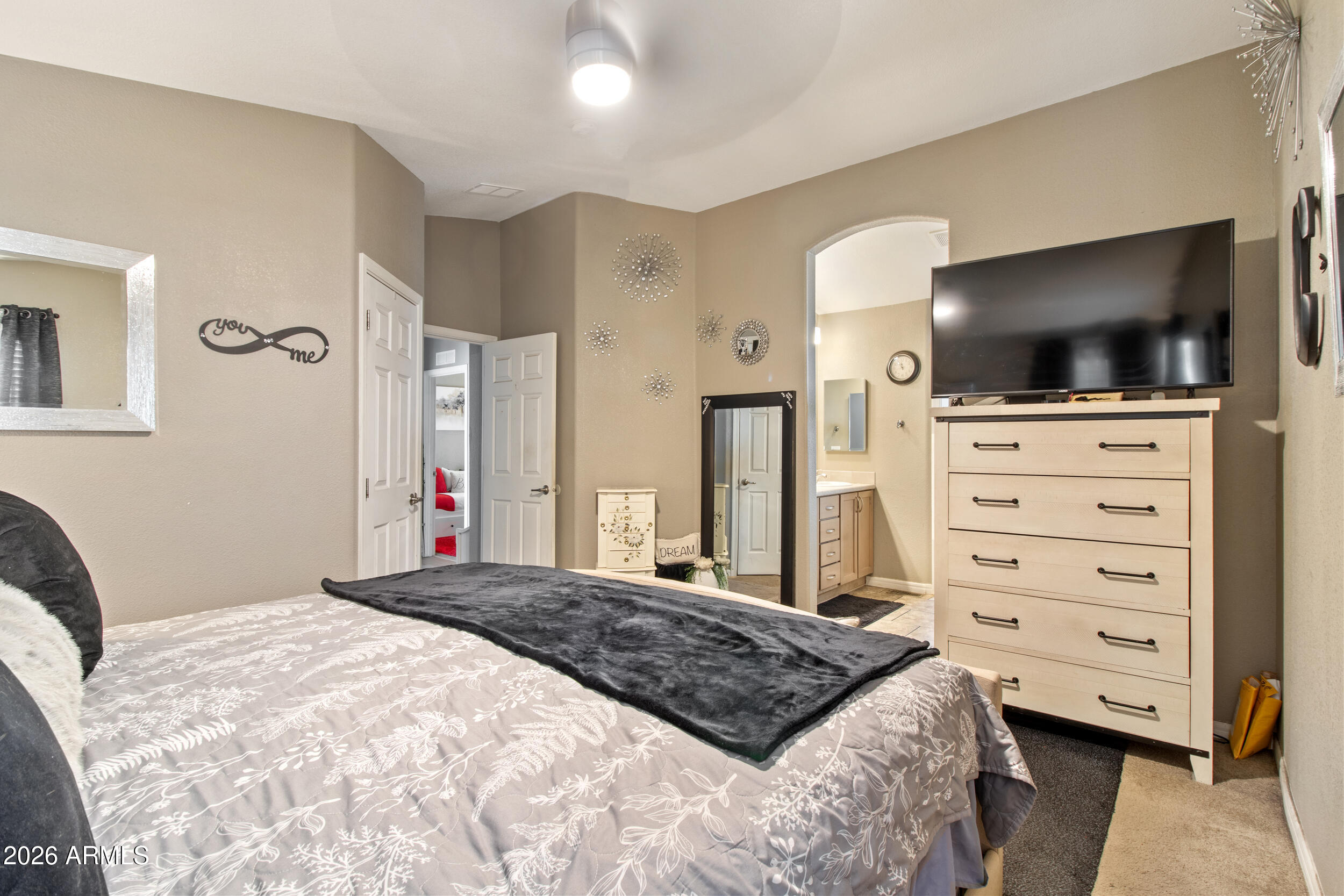 400 West Baseline Road, Unit 220 Tempe, AZ 85283 - Photo 24 of 52 a bedroom with a bed and a flat screen tv