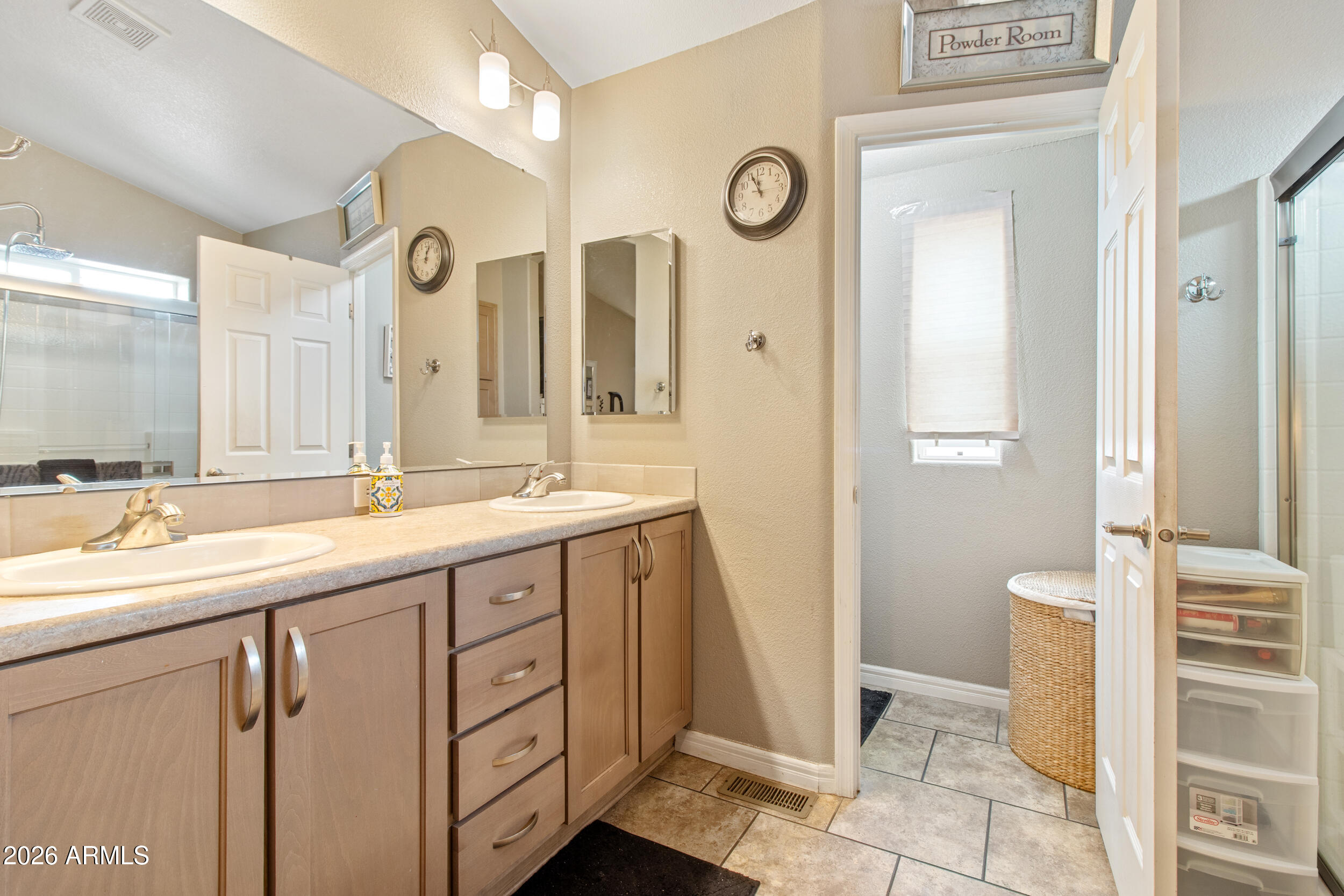 400 West Baseline Road, Unit 220 Tempe, AZ 85283 - Photo 25 of 52 a spacious bathroom with a double vanity sink and a mirror