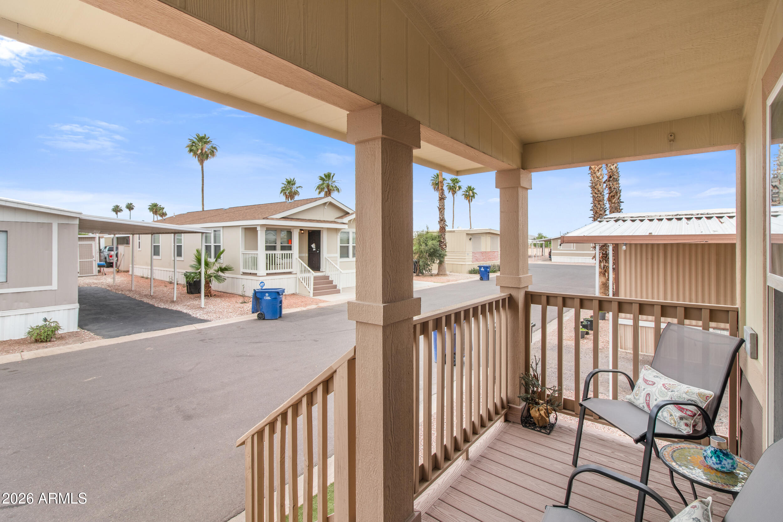 400 West Baseline Road, Unit 220 Tempe, AZ 85283 - Photo 33 of 52 a view of a balcony with furniture and wooden floor