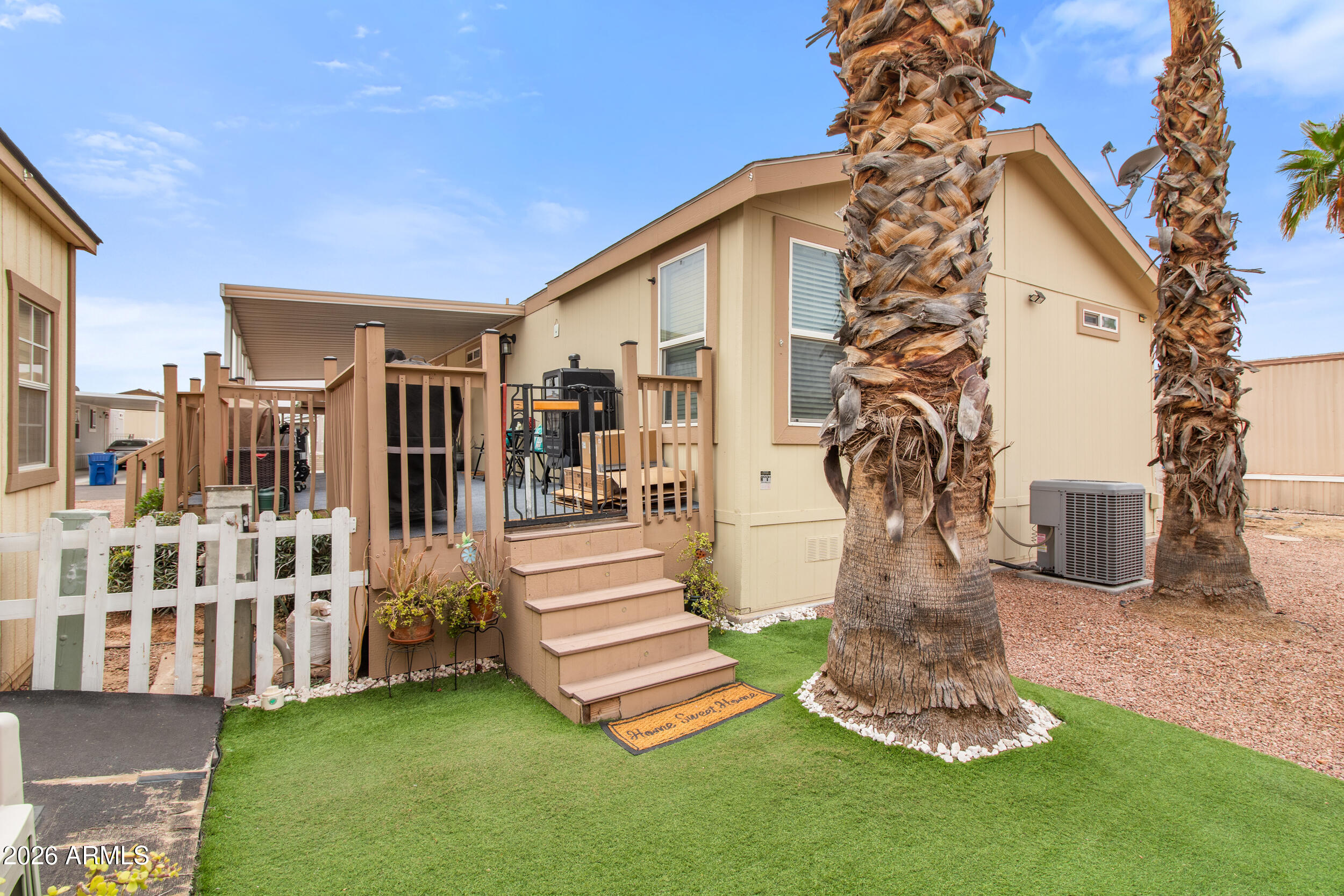 400 West Baseline Road, Unit 220 Tempe, AZ 85283 - Photo 37 of 52 a front view of a house with a yard garden