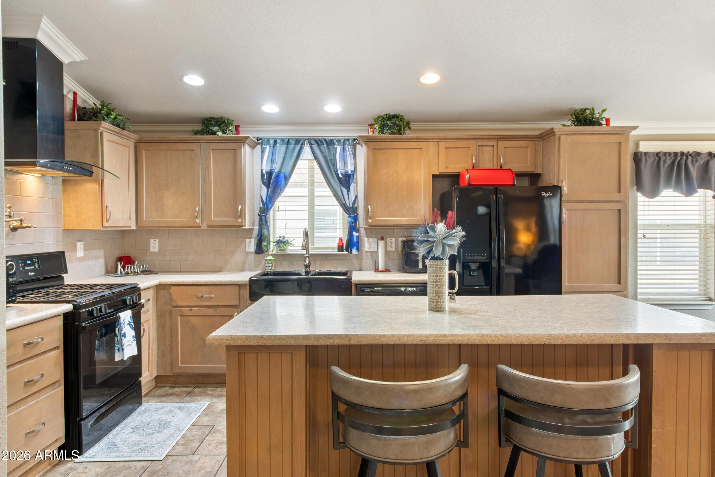 400 West Baseline Road, Unit 220 Tempe, AZ 85283 - Photo 7 of 52 a kitchen with a stove a sink and a refrigerator