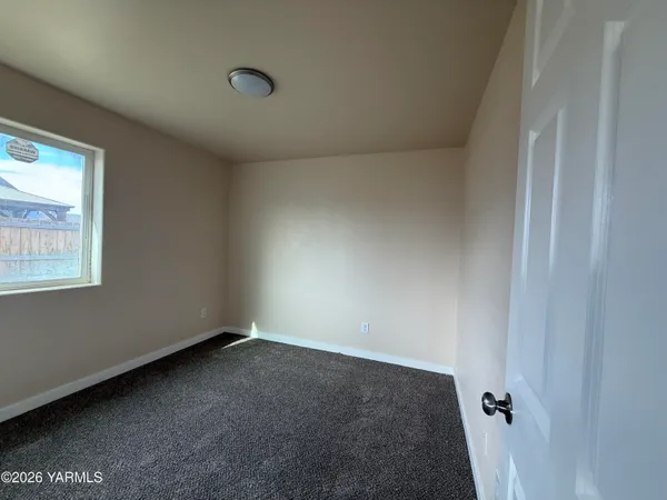 a view of a hallway to a bedroom