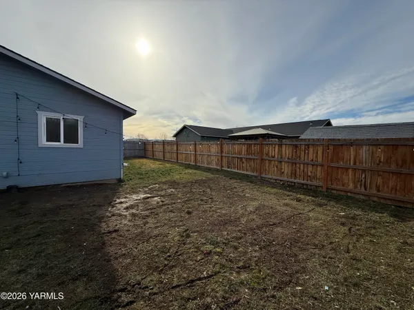 a kitchen with granite countertop a stove and a microwave