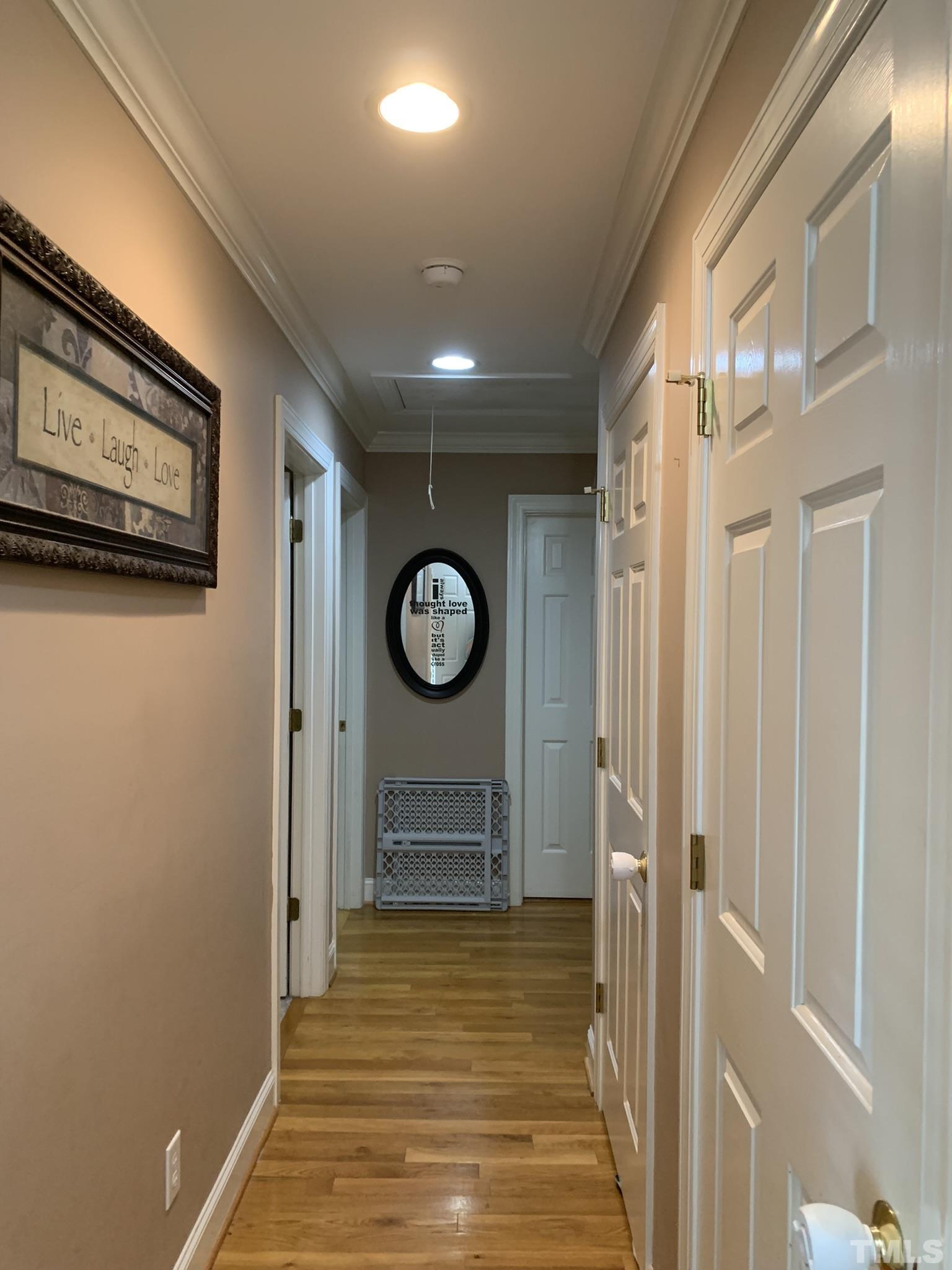 102 Younger Road Roxboro, NC 27573 - Photo 12 of 16 a view of a hallway with wooden floor