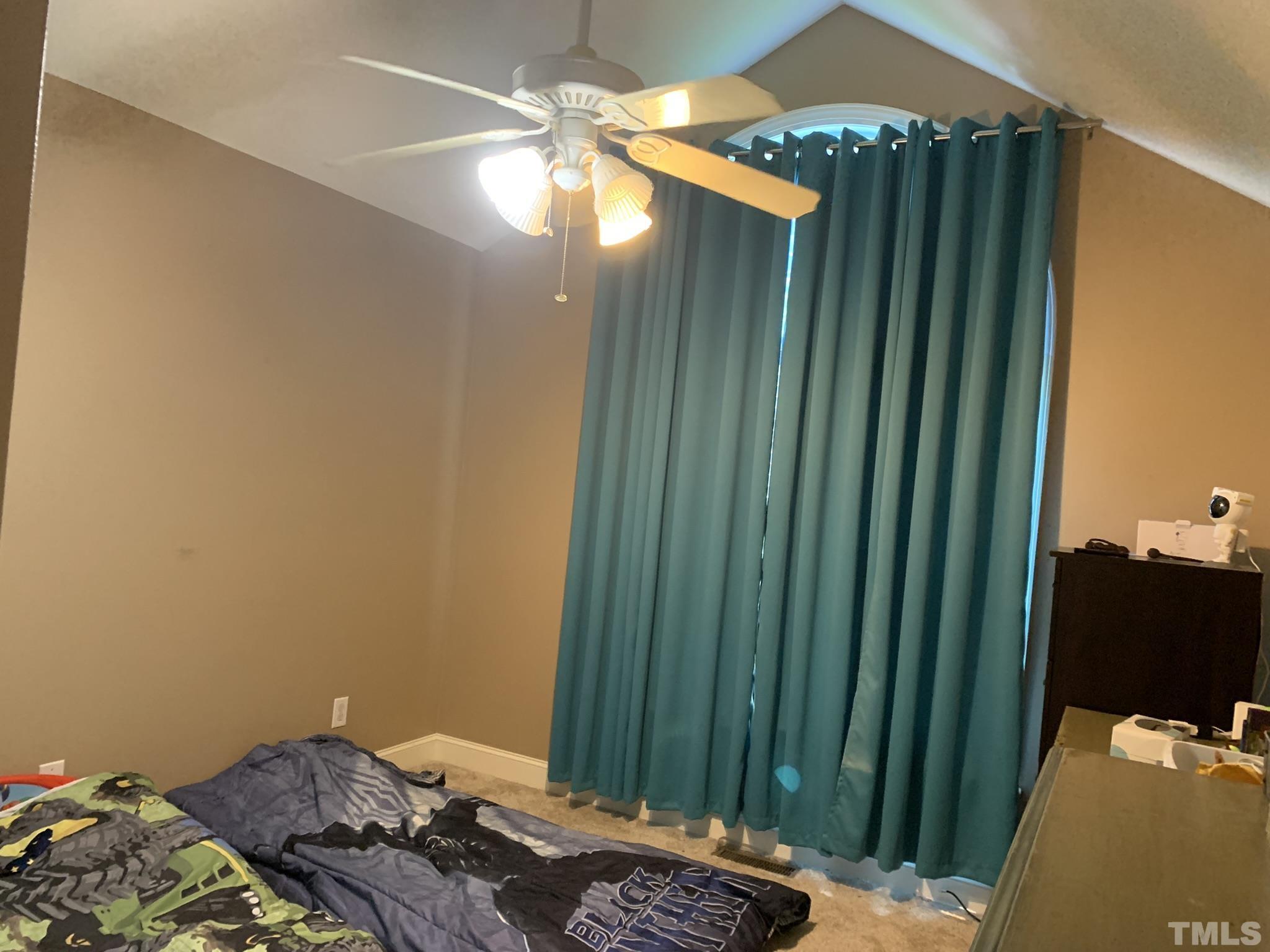 102 Younger Road Roxboro, NC 27573 - Photo 14 of 16 a bedroom with a bed and a window