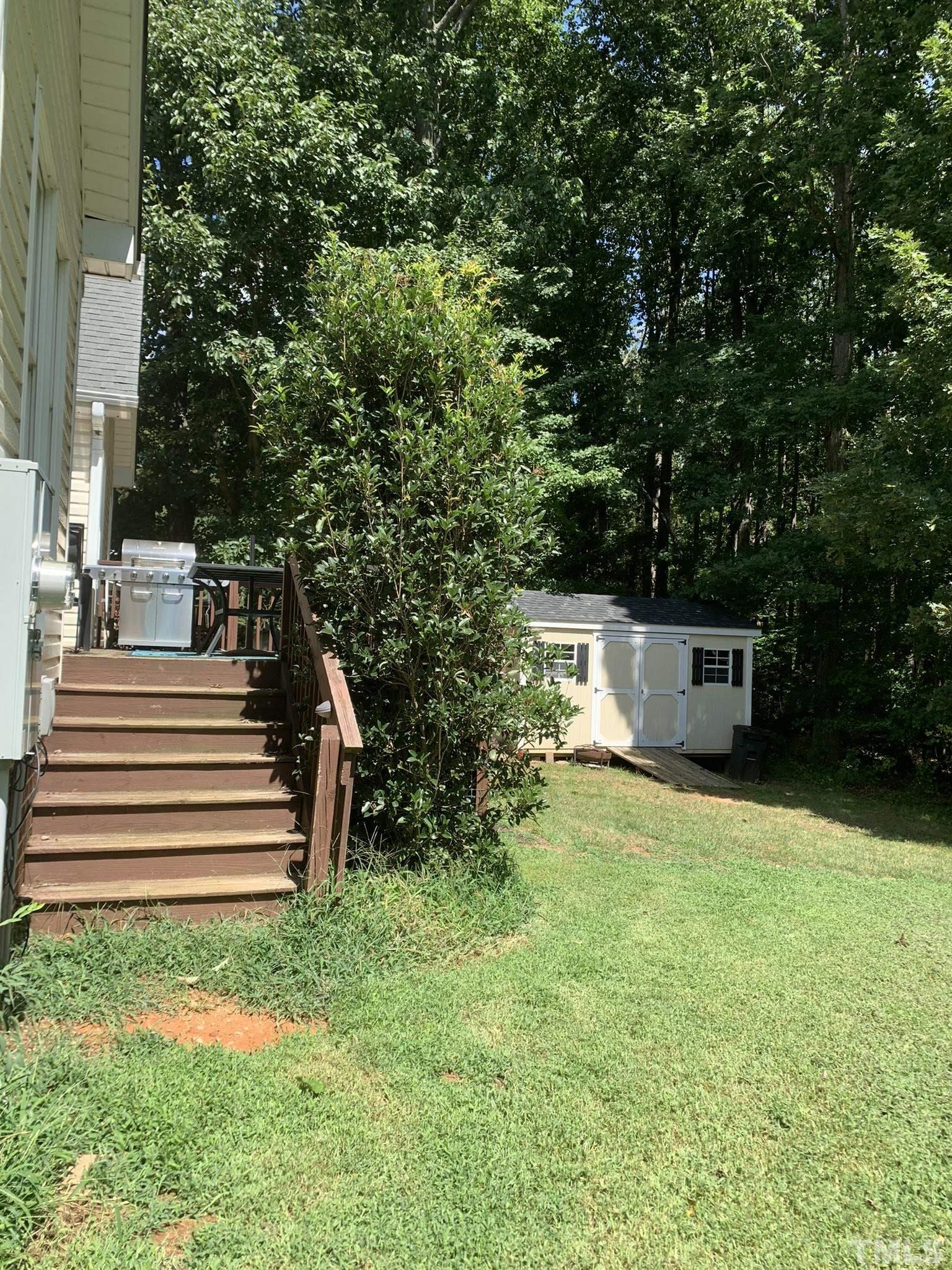 102 Younger Road Roxboro, NC 27573 - Photo 2 of 16 a view of a house with a yard