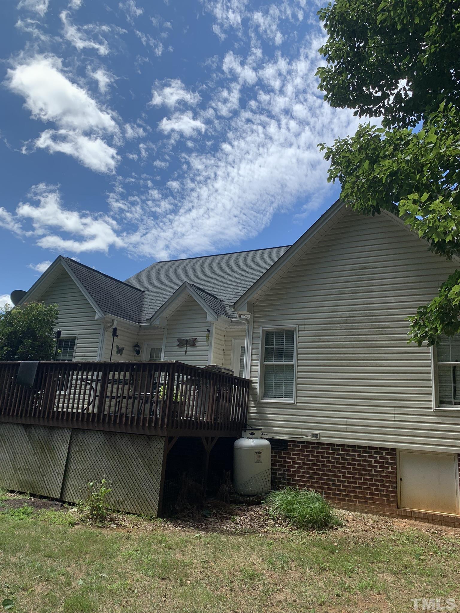 102 Younger Road Roxboro, NC 27573 - Photo 3 of 16 a house view with a garden space