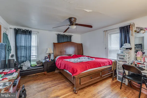 a bed room with a bed and a chair