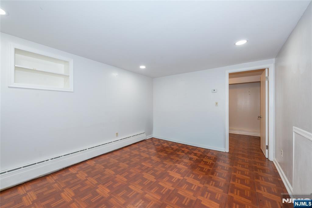 690 Garden Street Maywood, NJ 07607 - Photo 25 of 49 an empty room with a bench