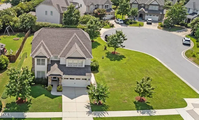 an aerial view of a house with a garden