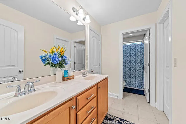 a bathroom with a sink double vanity and a mirror