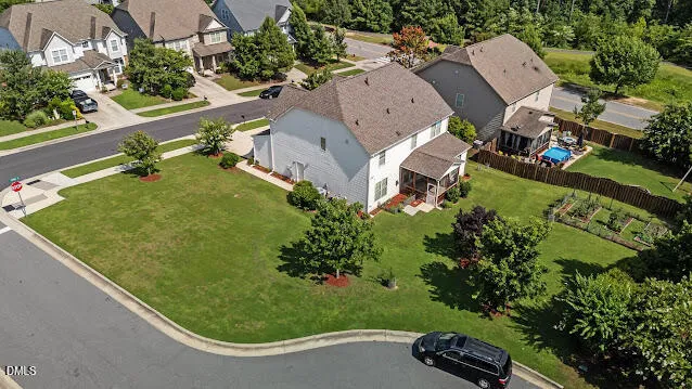 an aerial view of a pool yard swimming pool and outdoor seating