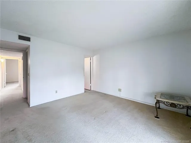 an empty room with a bench