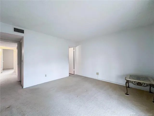 an empty room with a bench