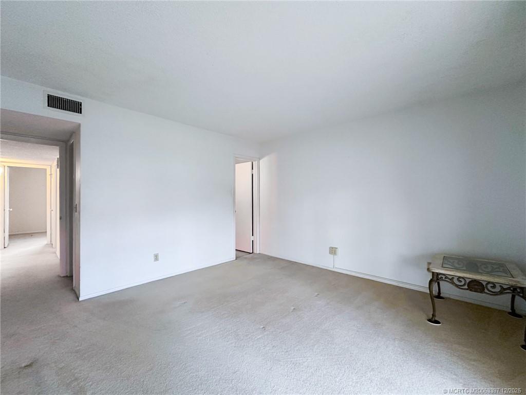 2600 Southeast Ocean Boulevard, Unit II1 Stuart, FL 34996 - Photo 17 of 38 an empty room with a bench