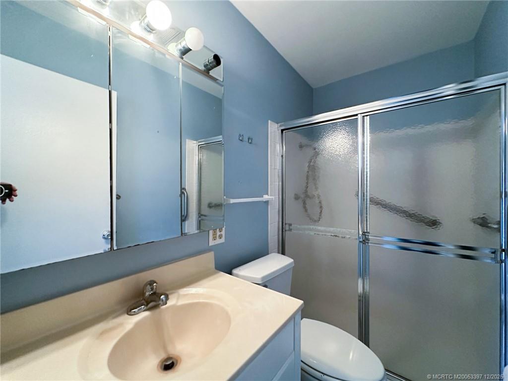 2600 Southeast Ocean Boulevard, Unit II1 Stuart, FL 34996 - Photo 20 of 38 a bathroom with a sink toilet and shower