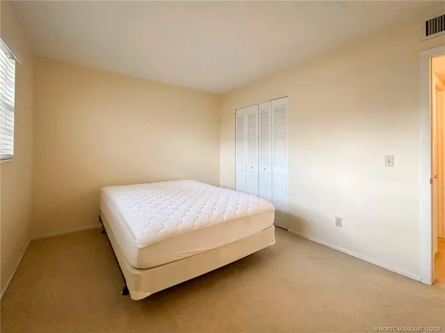 a room with a bed and a window