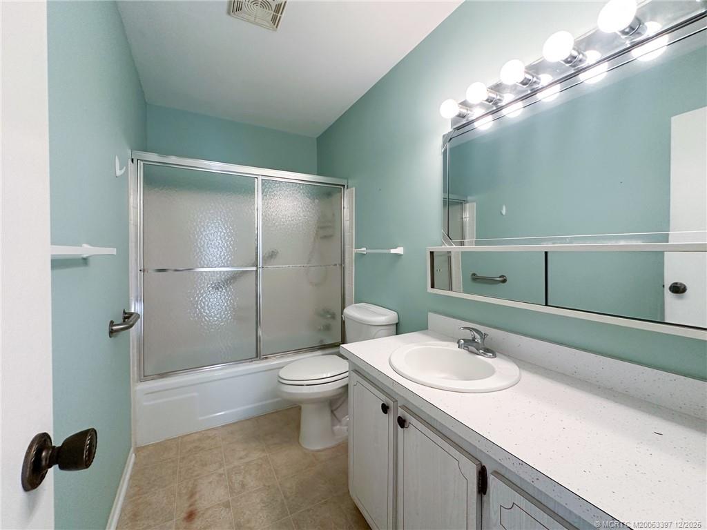2600 Southeast Ocean Boulevard, Unit II1 Stuart, FL 34996 - Photo 23 of 38 a bathroom with a sink a toilet and shower