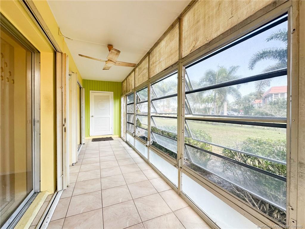 2600 Southeast Ocean Boulevard, Unit II1 Stuart, FL 34996 - Photo 26 of 38 a view of a porch with wooden floor and furniture