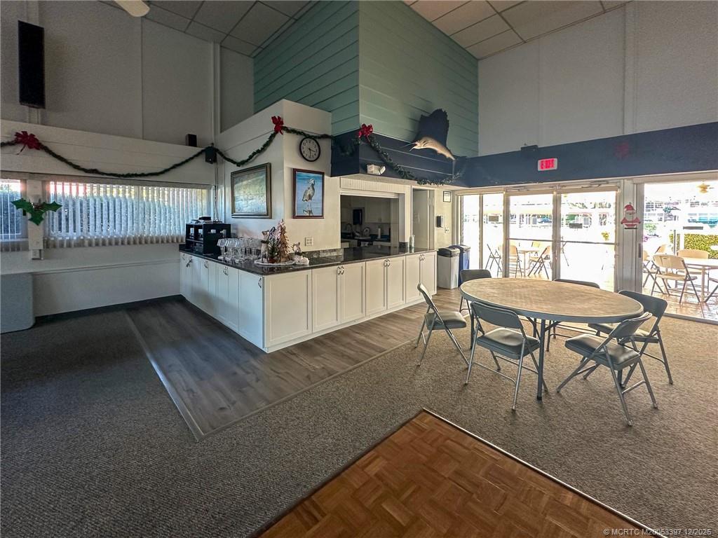 2600 Southeast Ocean Boulevard, Unit II1 Stuart, FL 34996 - Photo 35 of 38 a living room with furniture a fireplace and a flat screen tv